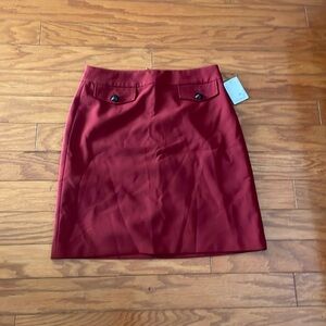 Simons red crest button skirt